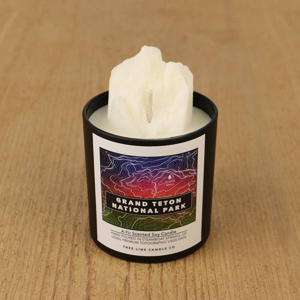 Grand Teton National Park soy candle by Tree Line Candle Co. featuring a 3D topographic mountain design and colorful Grand Teton map label, hand-poured in Steamboat Springs, Colorado.